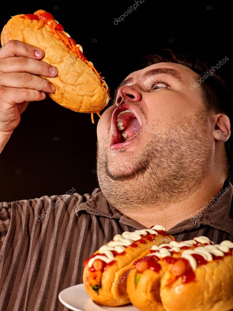 depositphotos_167894436-stock-photo-fat-man-eating-fast-food.jpg