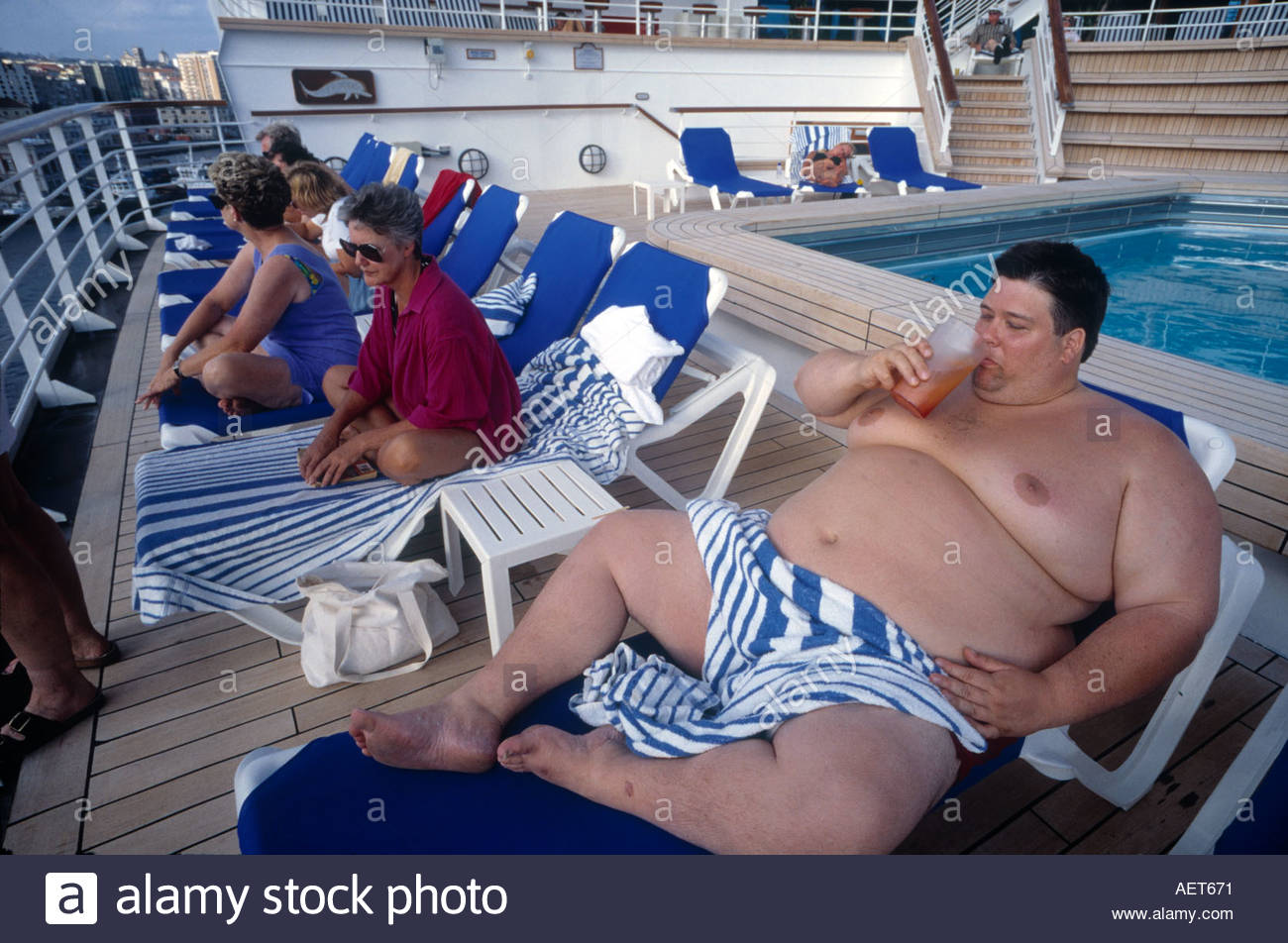 fat-man-enjoys-drink-on-deck-of-the-grand-princess-cruise-liner-boat-AET671.jpg