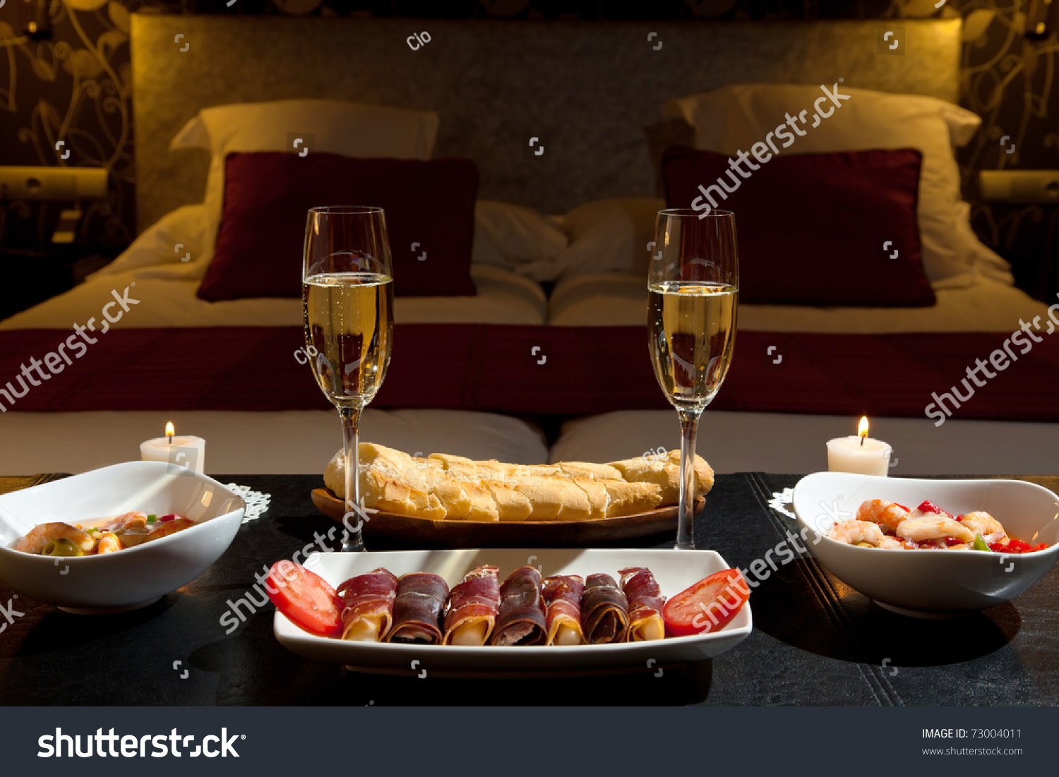 stock-photo-romantic-dinner-with-champagne-in-the-bedroom-73004011.jpg