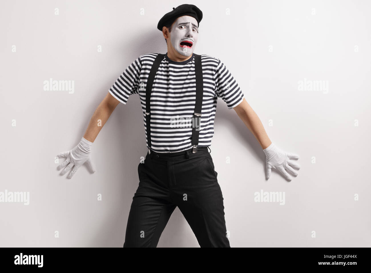 terrified-mime-against-a-wall-JGF44X.jpg