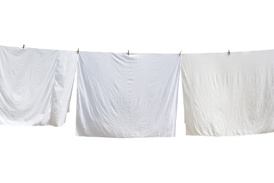 white-bed-sheets-hanging.jpg